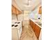 Stylish kitchen with updated appliances and open layout to living area at 64 Nome Way # C, Aurora, CO 80012