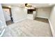 Bright and airy living room showcasing open-concept design with kitchen access at 64 Nome Way # C, Aurora, CO 80012