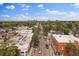 Aerial view of neighborhood lined with trees in a bustling metropolitan area beneath sunny skies at 1626 S Sherman St, Denver, CO 80210