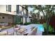 Backyard with patio, pool, and view of kitchen with island and dining area at 1626 S Sherman St, Denver, CO 80210