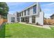 Contemporary home boasting a sprawling lawn and sleek architectural design with expansive windows at 1626 S Sherman St, Denver, CO 80210