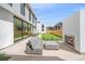 Outdoor patio features a modern fireplace and comfortable seating, perfect for relaxing and entertaining at 1626 S Sherman St, Denver, CO 80210