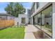 Large backyard with a patio and modern outdoor seating at 1626 S Sherman St, Denver, CO 80210