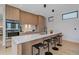 The kitchen features a quartz countertop island with seating and stainless steel appliances at 1626 S Sherman St, Denver, CO 80210