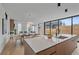 Open floor plan featuring a kitchen island, dining area, and seamlessly connected living spaces at 1626 S Sherman St, Denver, CO 80210