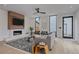 Bright living room features a fireplace, modern furniture, and large windows for ample natural light at 1626 S Sherman St, Denver, CO 80210