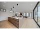 Spacious open concept with a modern kitchen island flowing to the living and dining areas at 1626 S Sherman St, Denver, CO 80210