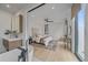 A serene main bedroom with modern bath featuring wood floors, neutral tones, and ample natural light at 1626 S Sherman St, Denver, CO 80210