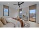 Light-filled main bedroom features hardwood floors, and large windows at 1626 S Sherman St, Denver, CO 80210