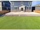 Backyard featuring a concrete patio and artificial grass at 20028 E 62Nd Ave, Aurora, CO 80019