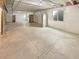 Unfinished basement area with concrete floor, exposed ceiling, and window at 20028 E 62Nd Ave, Aurora, CO 80019