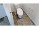 Stylish powder room with a modern toilet and unique tile flooring design at 20028 E 62Nd Ave, Aurora, CO 80019