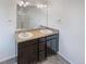 Updated bathroom featuring double vanity, framed mirror and modern fixtures at 20028 E 62Nd Ave, Aurora, CO 80019