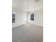 Bright bedroom with neutral carpeting and lots of natural light from two windows at 20028 E 62Nd Ave, Aurora, CO 80019