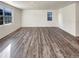 Bright and airy living room featuring hard surface floors and large windows at 20028 E 62Nd Ave, Aurora, CO 80019