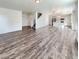 Spacious open-concept living room featuring vinyl floors and bright, neutral tones at 20028 E 62Nd Ave, Aurora, CO 80019