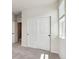 Bedroom with neutral carpet features a large window and big closet at 14135 Deertrack Ln, Parker, CO 80134