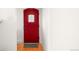 Interior view of the red front door with a diamond-patterned window at 4938 W Hayward Pl, Denver, CO 80212