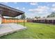 Large backyard featuring a covered patio and expansive lawn at 7952 Zuni St, Denver, CO 80221