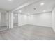 Spacious finished basement with recessed lighting and gray vinyl plank flooring at 7952 Zuni St, Denver, CO 80221