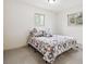 Bedroom with carpet, neutral walls and patterned bed coverings at 7952 Zuni St, Denver, CO 80221