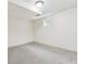Bedroom featuring neutral carpet and window at 7952 Zuni St, Denver, CO 80221