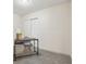 Bedroom featuring neutral carpet, grey chair and desk setup at 7952 Zuni St, Denver, CO 80221
