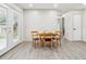 Dining area includes wood table with four chairs and a door to outside at 7952 Zuni St, Denver, CO 80221