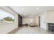 Light-filled living room showcases a modern fireplace, recessed lighting, and light-colored floors at 7952 Zuni St, Denver, CO 80221