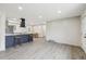 Open living space boasts an eat-in kitchen with a modern design, plus neutral paint at 7952 Zuni St, Denver, CO 80221