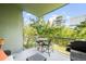 Balcony area with outdoor seating, a grill, and views of the surrounding greenery at 1401 Delgany St # 202, Denver, CO 80202