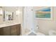 Bathroom boasts modern fixtures, a glass-enclosed shower, and a stylish vanity at 1401 Delgany St # 202, Denver, CO 80202