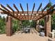 Outdoor kitchen and dining area features a grill and pergola at 1401 Delgany St # 202, Denver, CO 80202