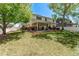 Backyard view showcasing a covered patio and grassy area at 105 Hawthorn St, Frederick, CO 80530
