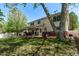 Spacious backyard with covered patio and expansive lawn, perfect for outdoor enjoyment at 105 Hawthorn St, Frederick, CO 80530