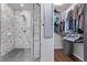 Modern bathroom with glass-enclosed shower and walk-in closet at 105 Hawthorn St, Frederick, CO 80530