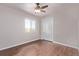 Bedroom with wood-look floors, window, and closet at 105 Hawthorn St, Frederick, CO 80530