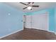 Comfortable bedroom with hardwood floors, a ceiling fan, and a spacious closet at 105 Hawthorn St, Frederick, CO 80530
