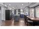 Wide kitchen and dining area featuring stainless steel appliances and ample counter space at 105 Hawthorn St, Frederick, CO 80530