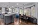 Spacious kitchen featuring a dining area, stainless steel appliances, and sleek countertops with ample natural light at 105 Hawthorn St, Frederick, CO 80530