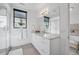 Bright bathroom featuring modern vanity with granite countertop and walk-in glass shower at 4214 E 8Th Pl, Denver, CO 80220