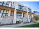 Beautiful contemporary townhome with modern design elements and lush landscaping at 4214 E 8Th Pl, Denver, CO 80220