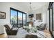 Bright living room with large windows, modern chandelier, stylish furniture, and wet bar at 4214 E 8Th Pl, Denver, CO 80220