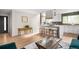 Bright, open kitchen boasts a large island with seating and modern appliances at 3089 S Jasmine St, Denver, CO 80222