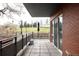 Spacious balcony providing a relaxing outdoor living space with views of greenery and a blue umbrella at 1438 Little Raven St # 104, Denver, CO 80202
