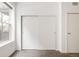 Bedroom showcasing sliding-door closet and natural light at 1438 Little Raven St # 104, Denver, CO 80202