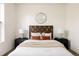 Bedroom featuring a decorative mirror and two side tables at 1438 Little Raven St # 104, Denver, CO 80202