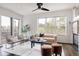 Cozy living room with comfortable seating, modern decor, and natural light from large windows at 1438 Little Raven St # 104, Denver, CO 80202