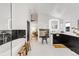 Modern bathroom with a soaking tub, black marble accent wall, and view of the bedroom at 520 Columbine St, Denver, CO 80206