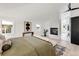 Sunlit bedroom boasting a modern fireplace, bench seating, and stylish decor at 520 Columbine St, Denver, CO 80206